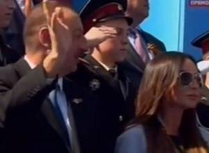 What is Aliyev saying to his wife during parade?