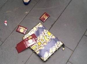 HHK membership cards thrown on the ground outside Government building