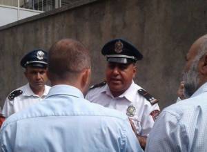 Music sounds in the court yard: policeman threatens to detain