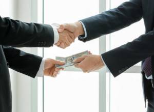 Doctor induces more than 20 persons to pass him bribe under pretext of employment