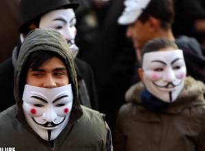 Policemen put out torches of participants of Anonymous demonstration