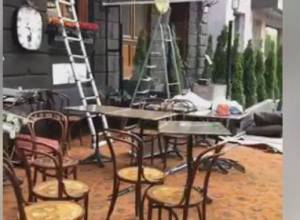 Open-air cafes and fast food stalls being dismantled