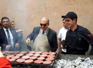 President Armen Sargsyan prepares hamburgers for children