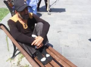 Citizen hammers his legs in Republic Square