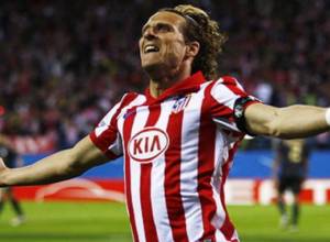 Forlan shocks Liverpool