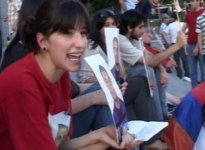 Activists hold a sit-down strike