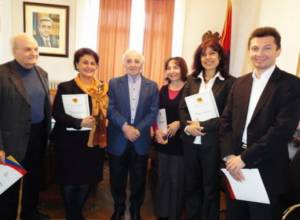 Charles Aznavour hands over certificates of gratitude