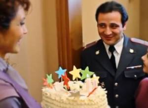 Congratulating police officers with cake