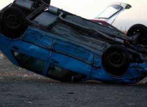 Car turns over near restuarant