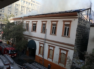 Fire on roof of Dolmama restaurant isolated