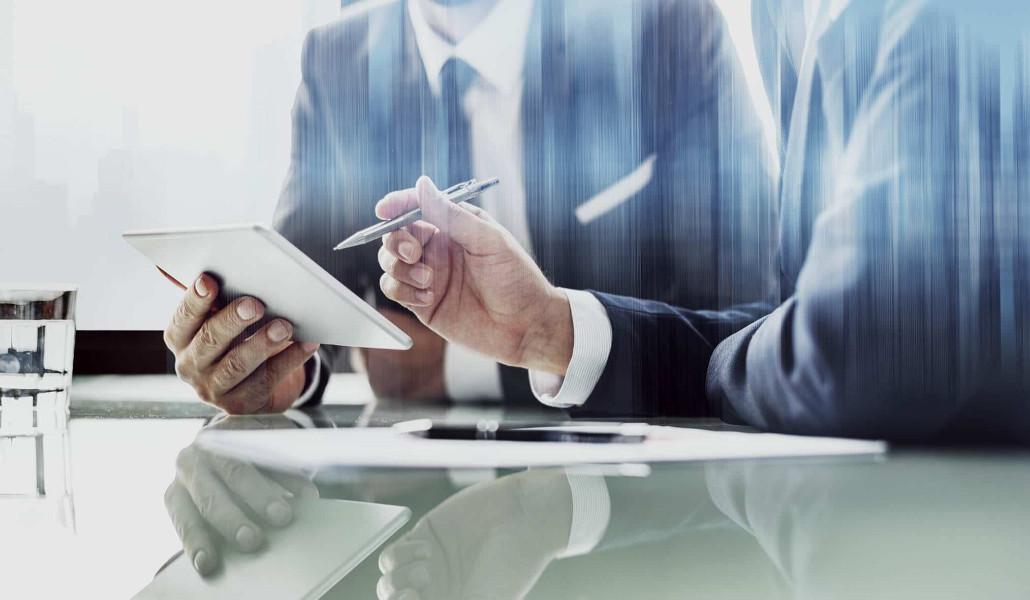 corporate-businessmen-working-on-tablet-at-office-bd-1-1